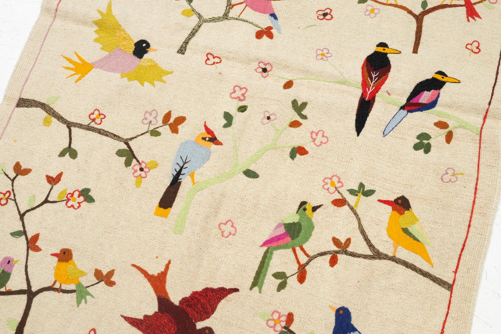 A hand-embroidered kilim rug, c. 180 x 125 cm.