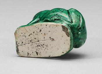 A green glazed biscuit water dropper, in the shape of a frog, Qing dynasty, Kangxi (1662-1722).