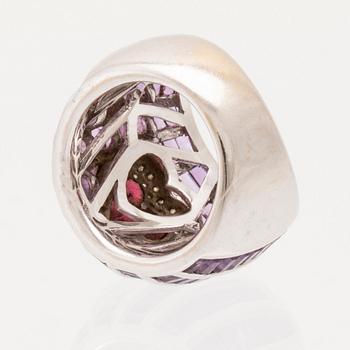 An 18K white gold Cocktail ring set with round brilliant-cut diamonds, step-cut amethysts and garnets.