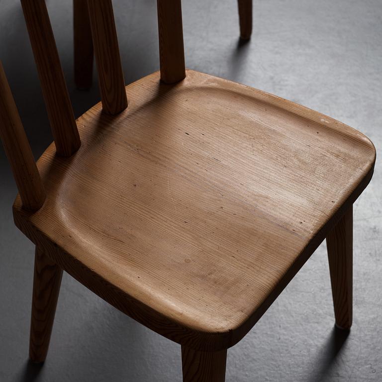 Axel Einar Hjorth, a set of six "Utö" stained pine chairs, Nordiska Kompaniet, Sweden 1930's.