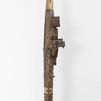 A snaphaunce gun, 19th Century.