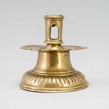 A 16th century bronze candlestick.