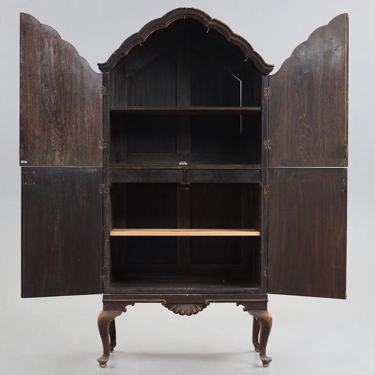 Tor Hörlin, a Swedish Grace decorated oak cabinet, dated 1920.