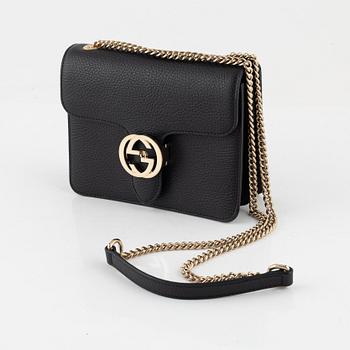 Gucci, a black leather 'Interlocking G' bag.