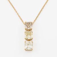 Pendant with chain in 18K gold set with a radiant-cut diamond and two cushion-cut diamonds.