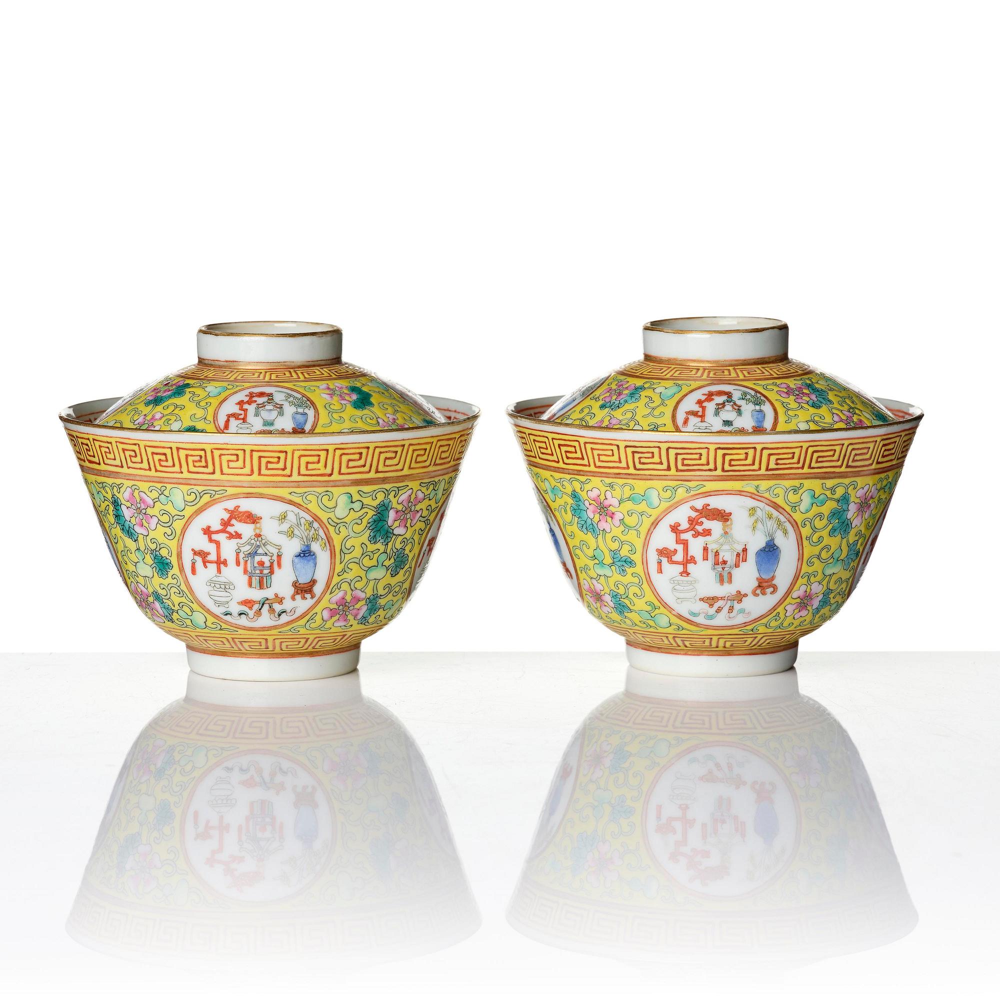 A pair of yellow ground 'medallion' bowls with covers, Qing dynasty with Daoguang mark.
