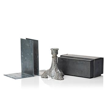 A pair book ends, candlestick and metal box from Parts of Four.