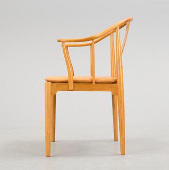 A Hans J Wegner 'Kinastolen' armchair, Fritz Hansen, Denmark 1971.