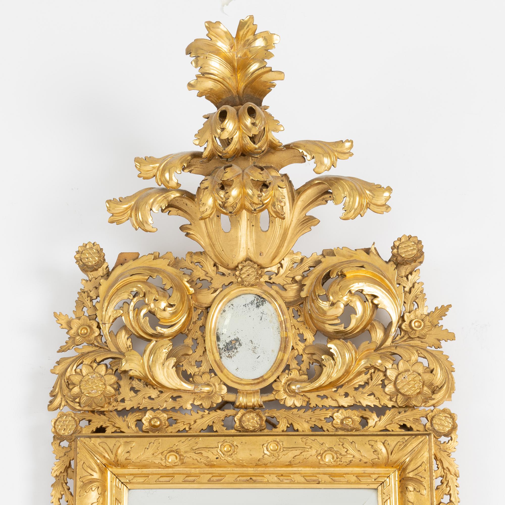 A 20th century Baroque style mirror.