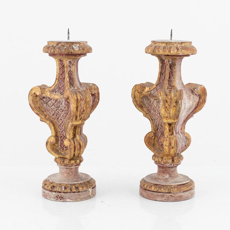 A pair of carved Baroque pricket candlesticks, first part of the 18th century.
