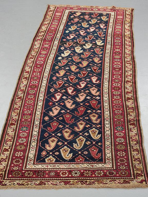 A runner, an antique Karabagh, ca 268,5-278 x 98,5-103,5 cm.