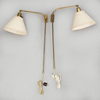 A pair of brass wall lamps by Josef Frank for Firma Svenskt Tenn.