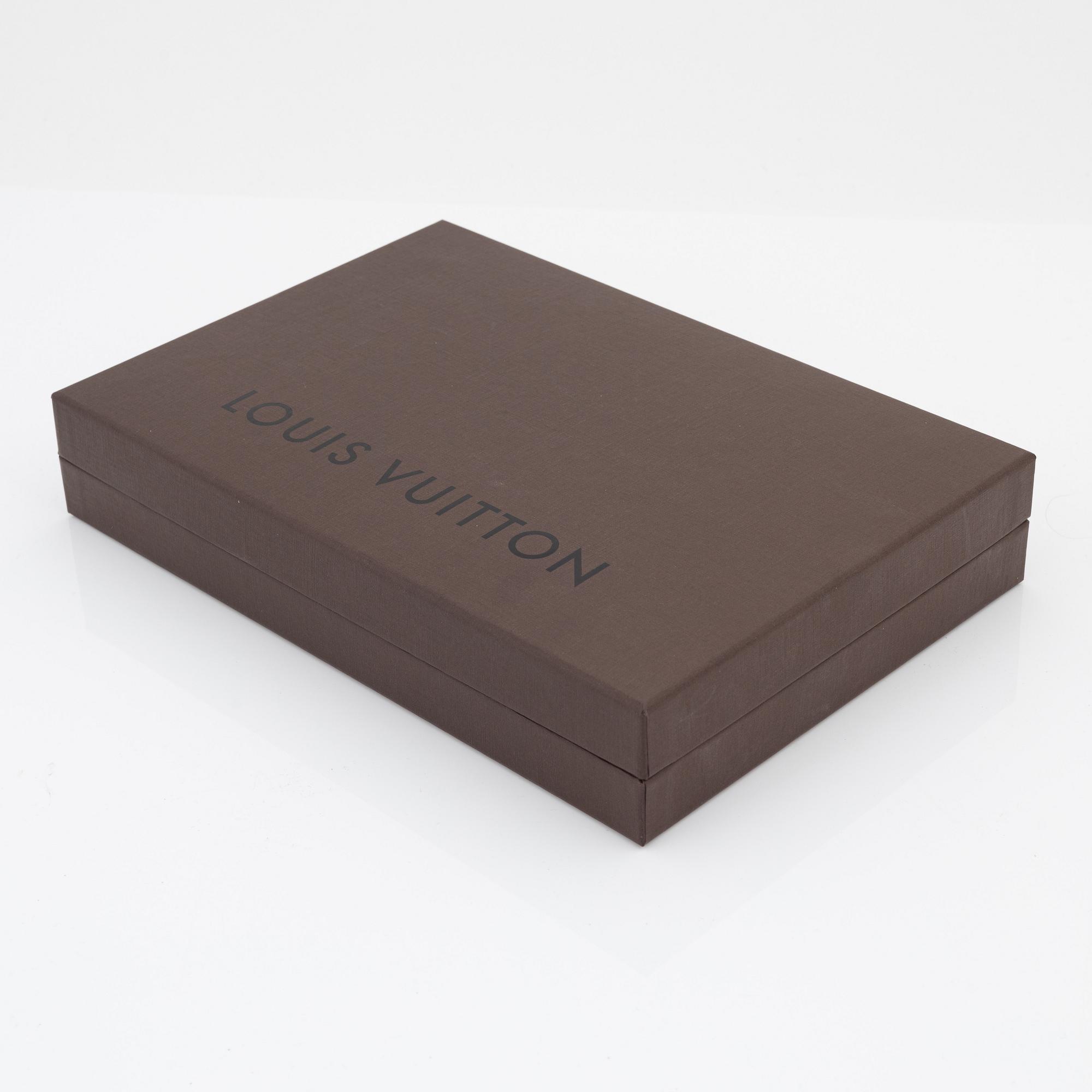 Louis Vuitton, a monogram "Trousse kit de voyage' travel kit with inflatible pillow and eye mask.