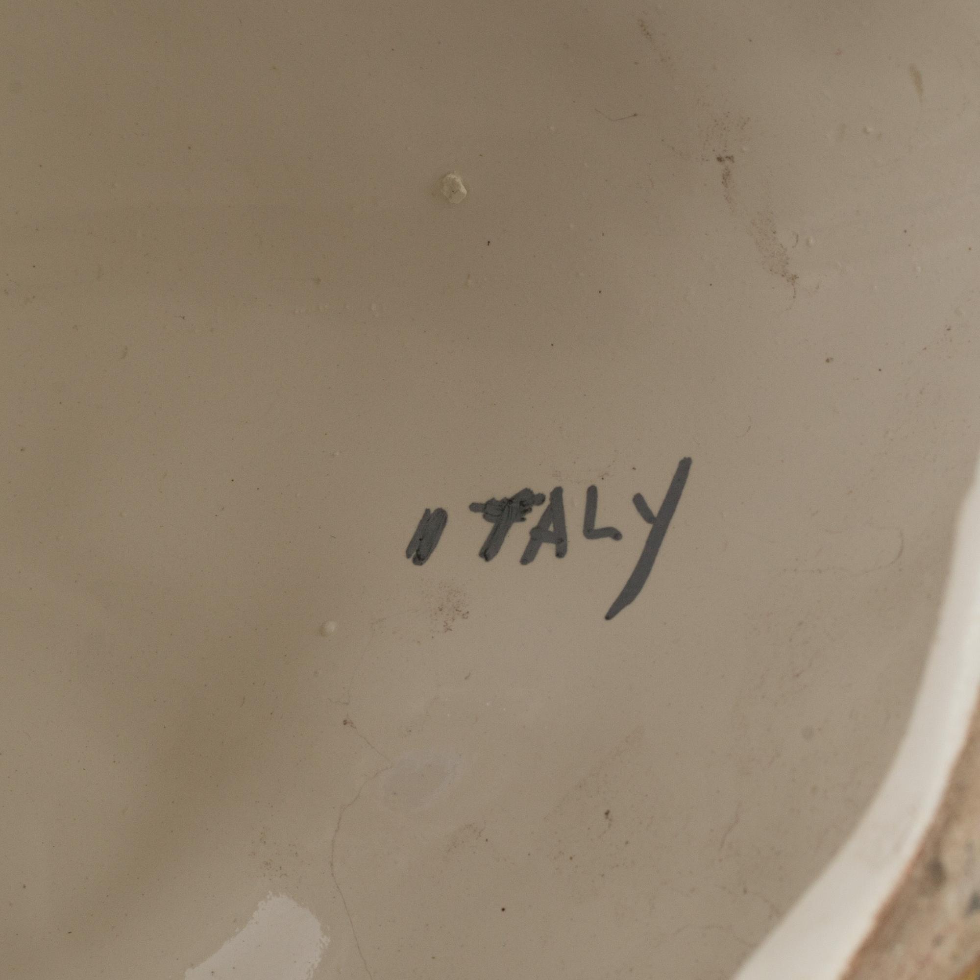 A pair of 70s italian porcelain figurines.