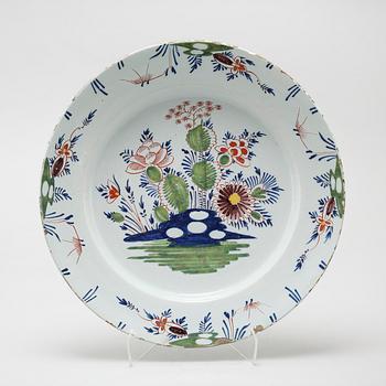 A faience dish, 18th century.