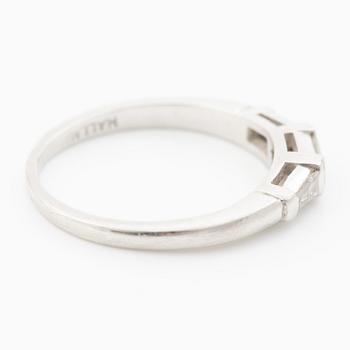 Platinum ring with baguette-cut diamonds.