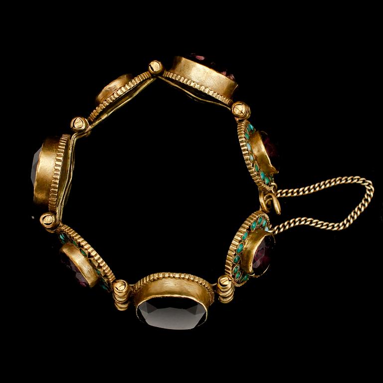 ARMBAND, mässing och turkoser, 1900-talets första hälft.