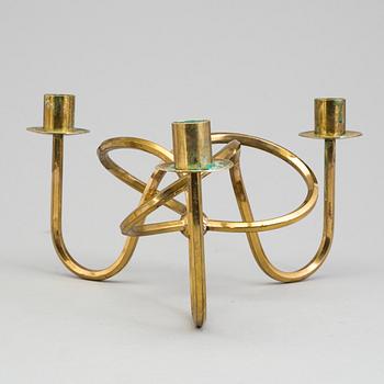 JOSEF FRANK, ljusstake, mässing ”Vänskapsknuten”, Firma Svenskt Tenn.