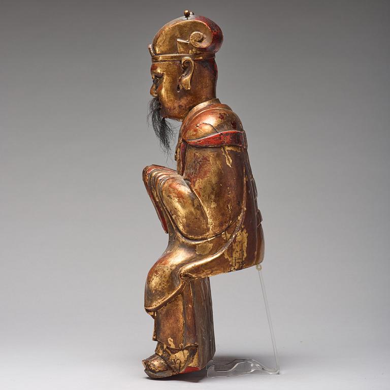 A large wooden sculpture of a Daoist dignitary, Qing dynasty, 17/18th Century.