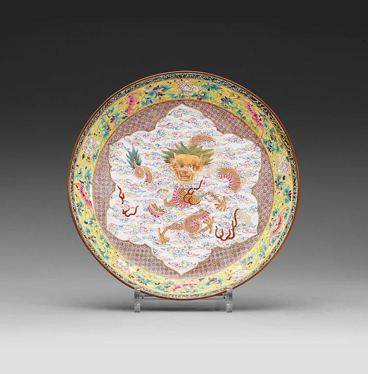 An enamel on copper dish, Qing dynasty 18th century.