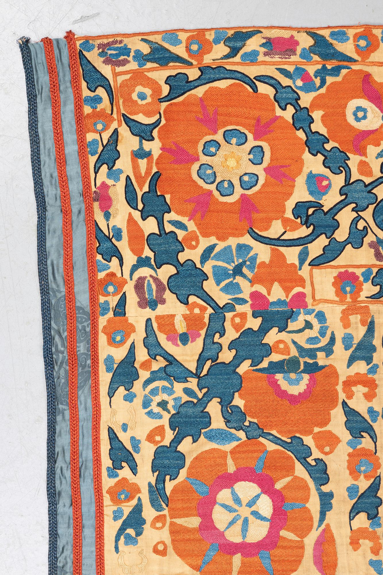 An embroidery, an antique suzani, ca 230 x 169 cm.