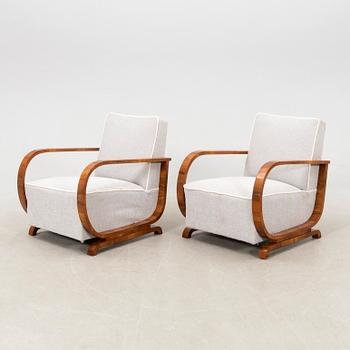 A pair of Art Deco armchairs.