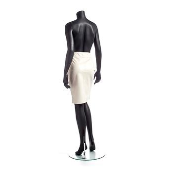 GUCCI, a white leather skirt.
