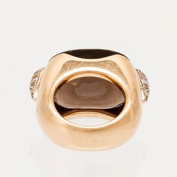 An 18K gold Pomellato "Pin Up" ring set with smoky quartz and round brilliant-cut diamonds.