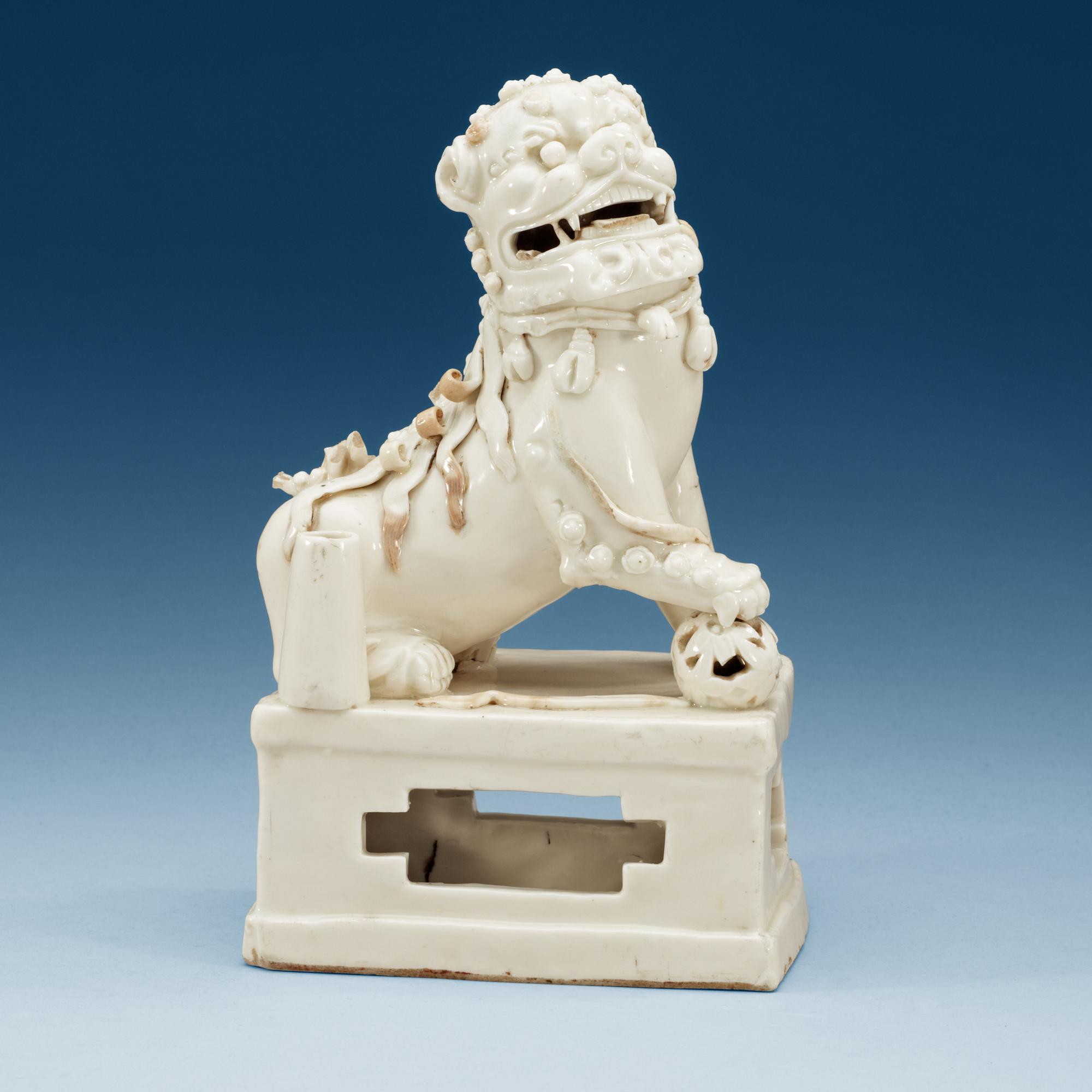 A blanc de chine censer, in the shape of a sitting Buddhist lion, Transition, 17th Century.