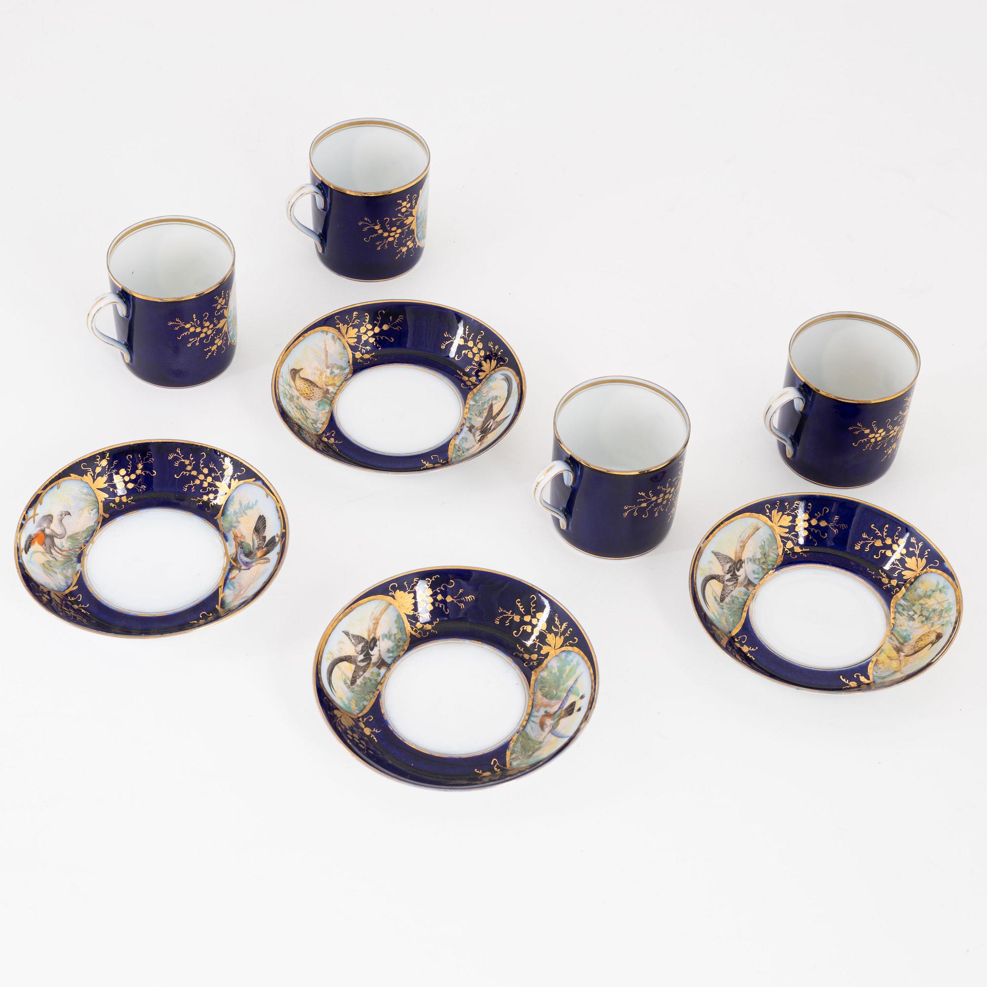 A set of four Russian cups with stands, Kuznetsov (1891-1917).