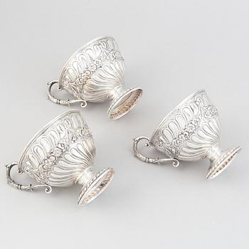 Three parcel-gilt silver chocolat-cups, mark of CG Hallberg, Stockholm 1896. Louis XVI-style.