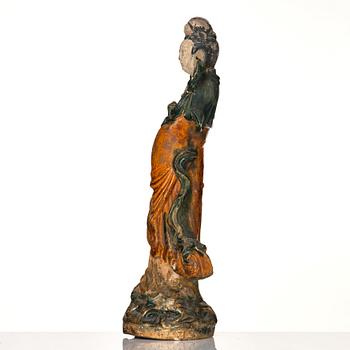 A green and yellow glazed Guanyin figure, late Ming dynasty/Qingdynasty.