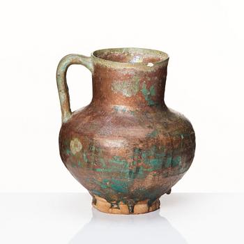 A 12-13th century turquoise and black underglazed jug.
