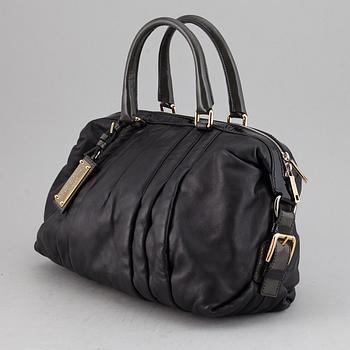 DOLCE & GABBANA, a black leather bag.