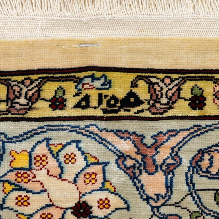 A silk Hereke rug, Turkey, approx. 82 x 58 cm.