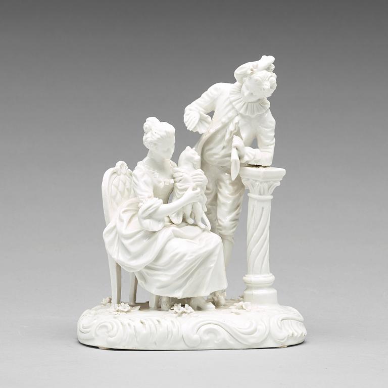 A white glazed porcelain figure of a courting couple with a cat, Frankenthal, 18th Century.