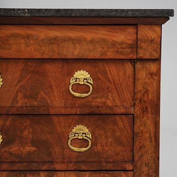 A French Empire mahogany commode, early 19th century.
