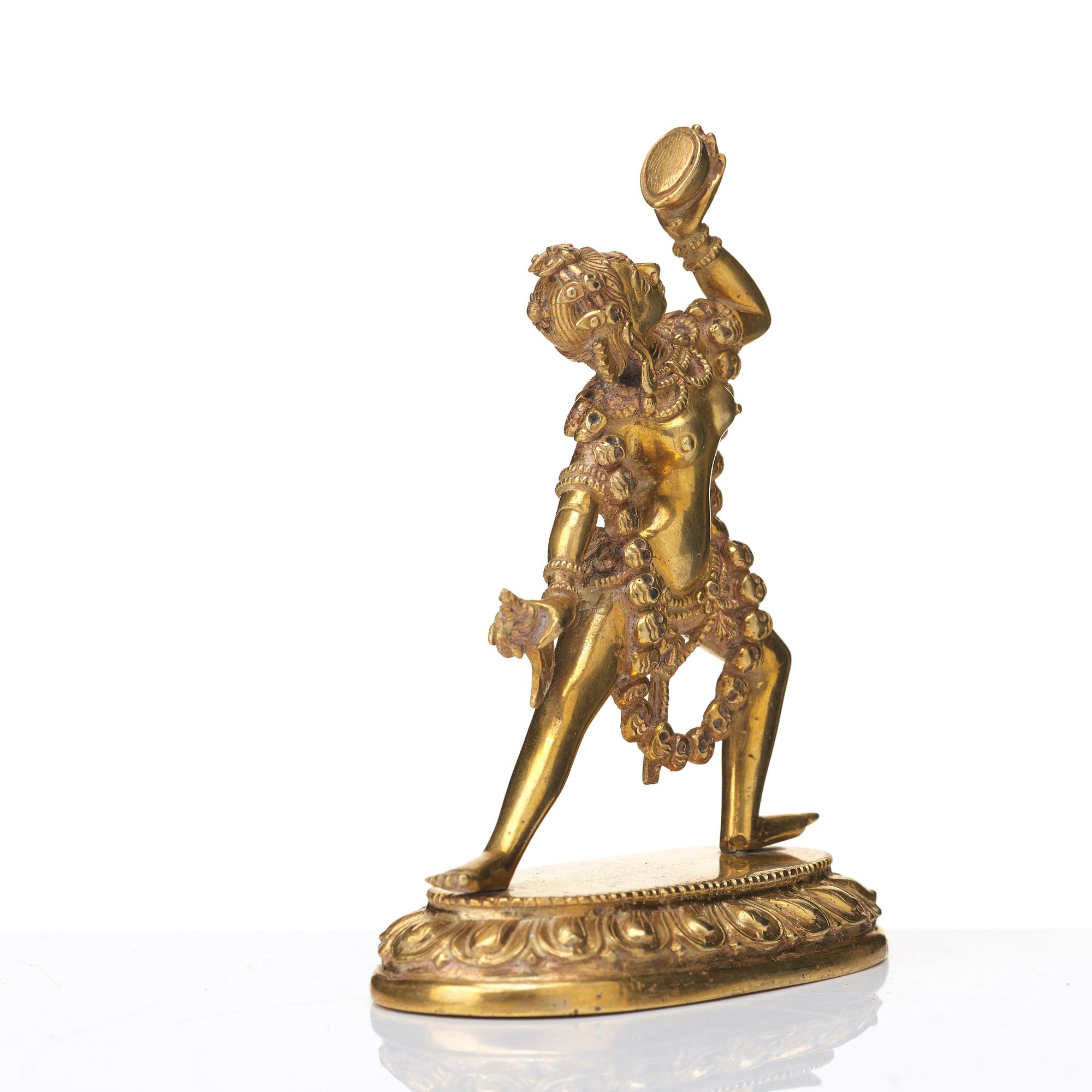 A gilt bronze figure of Dakini, Tibeto-Chinese, 19th Century.