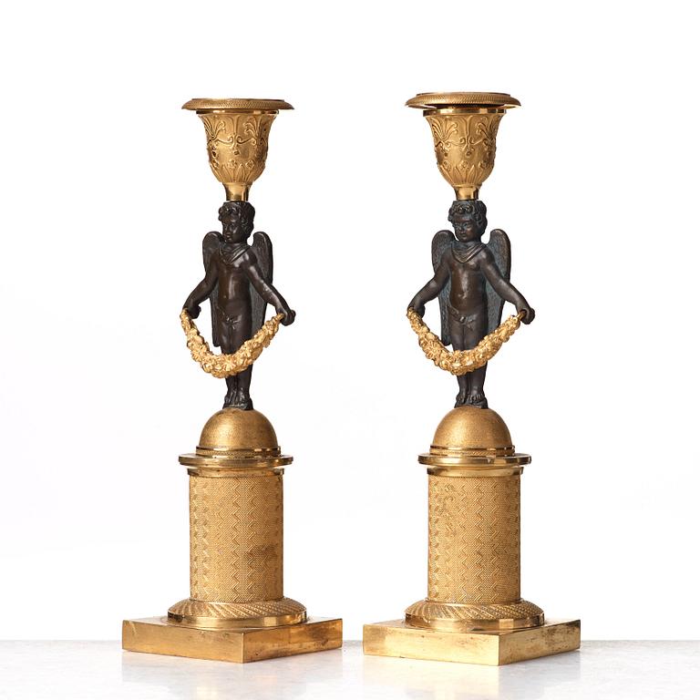 A pair of Empire early 19th century candlesticks.