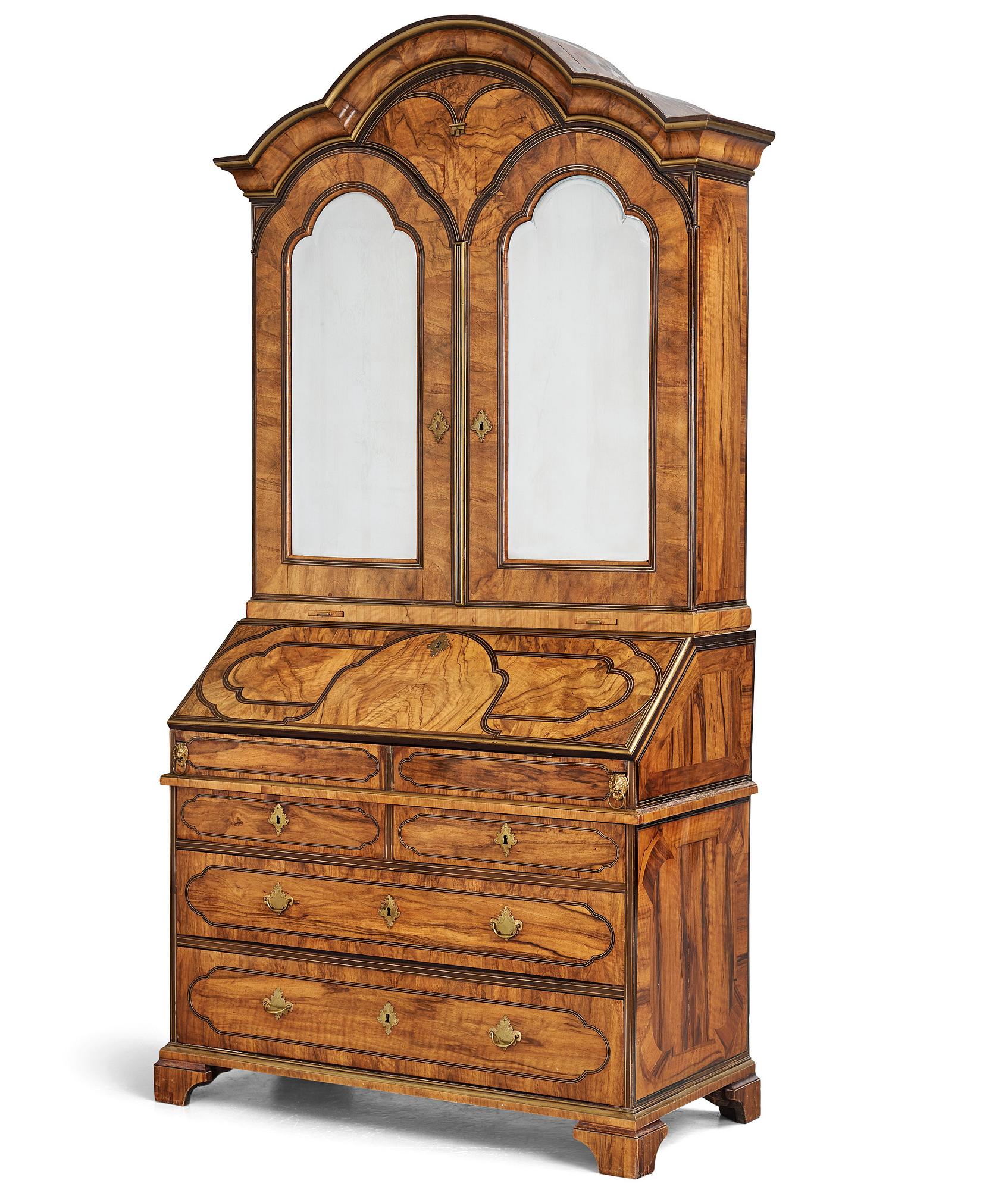 A late Baroque walnut veneer cabinet, mid 18th century.