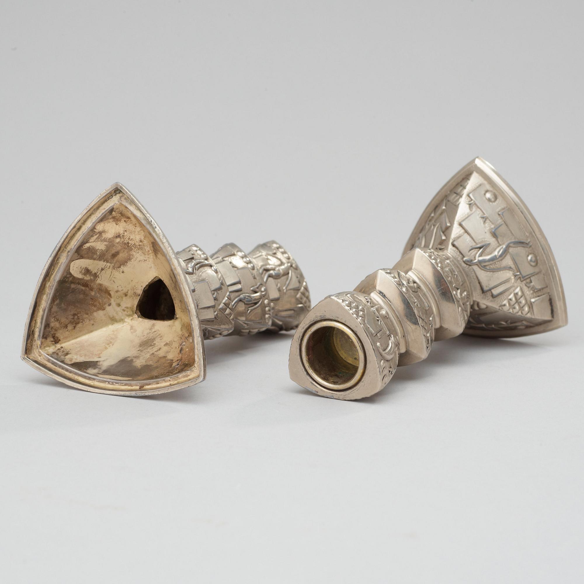 A pair of white metal candlesticks, 1920-30's.