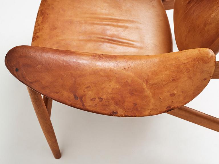 Finn Juhl, a teak and natural brown leather "Chieftain Chair" by Niels Vodder, 1950-60's.