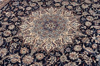 A Nain part silk carpet, c. 535 x 340 cm.