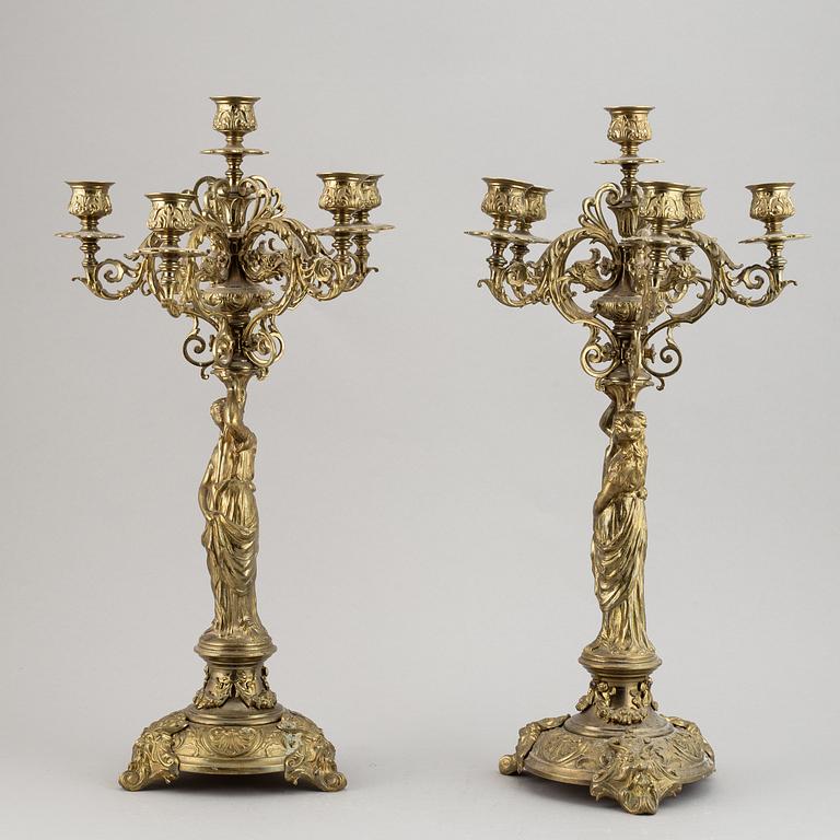 A pair of late 19th century brass candelabra for six candles.