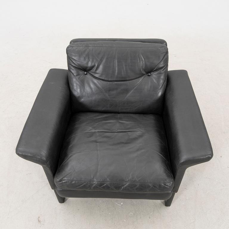 A 1960/70s Hans Olsen leather armchair.
