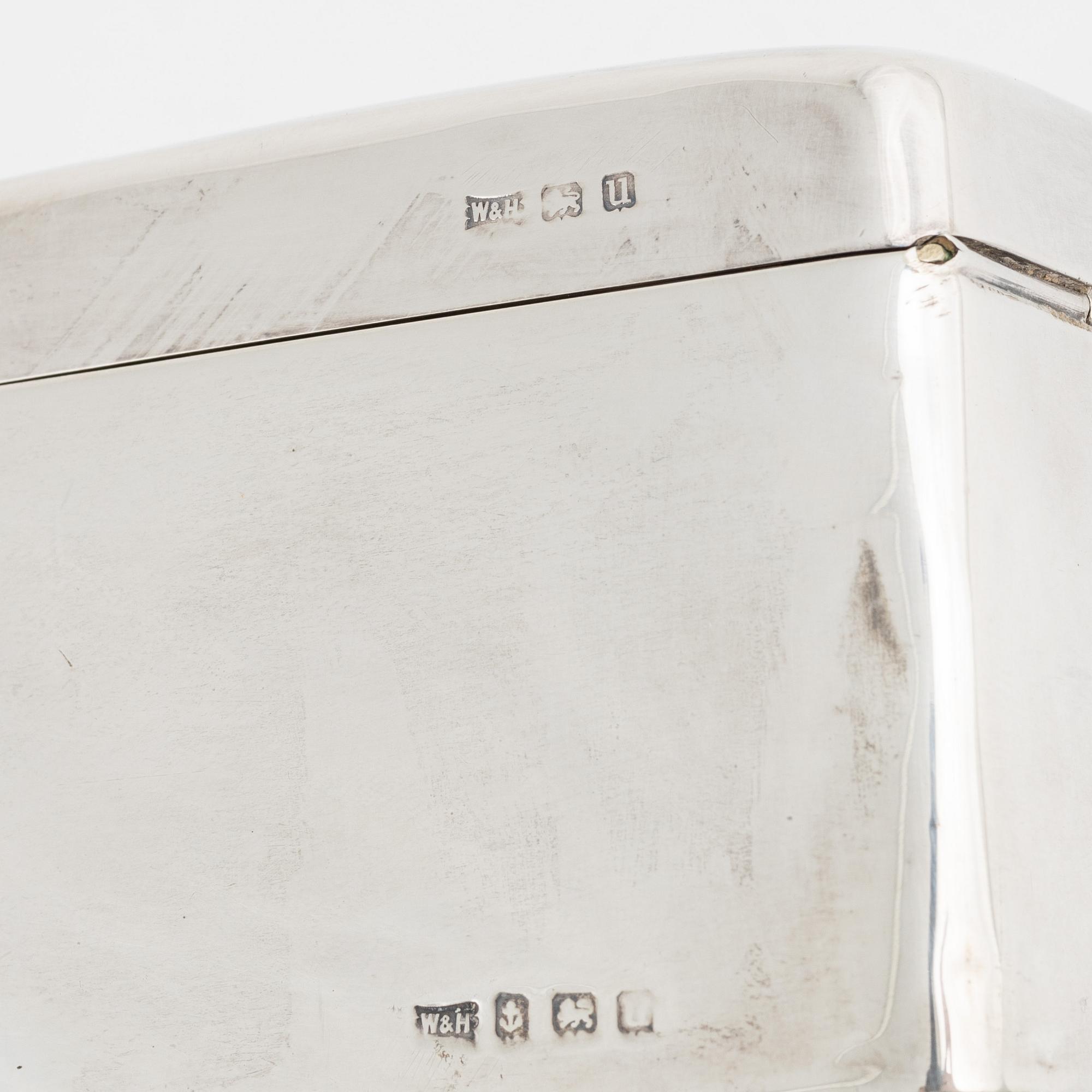 A silver cigarette box, Walker & Hall, Birmingham, England, 1919.