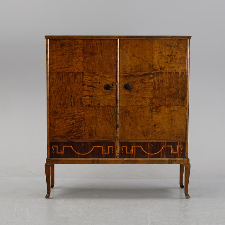 A 1920's-30's Swedish Grace birch and rosewood veneered cabinet.
