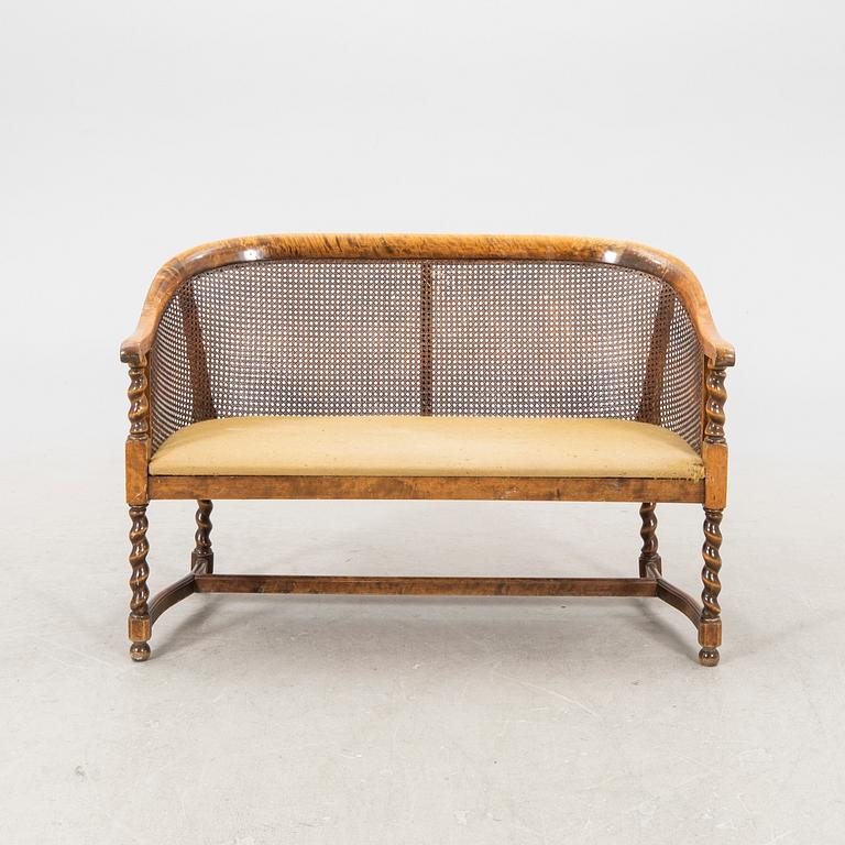 A 1920s rattan sofa.