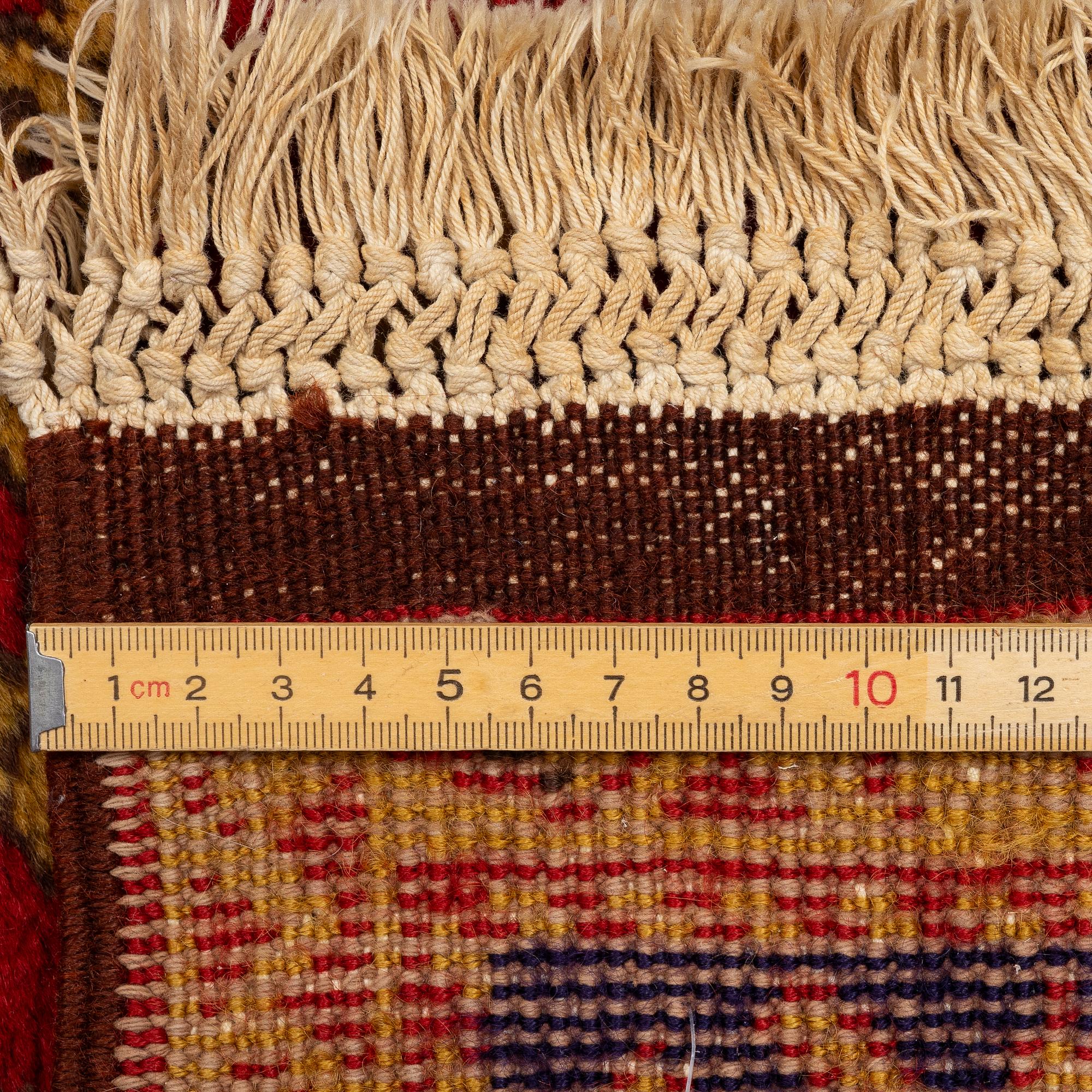 A semi antique Romanian "Lotto" rug, c. 214 x 123 cm.