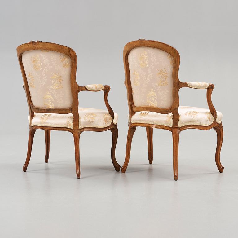 Two matched Louis XV 18th century armchairs.